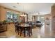Open concept dining area with decorative chandelier adjacent to the living space and with natural light at 4553 W Kirkland Ave, San Tan Valley, AZ 85144