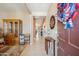 Bright foyer with tile flooring and stylish decor that leads into an open floor plan at 4553 W Kirkland Ave, San Tan Valley, AZ 85144