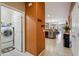Hallway featuring tile flooring and an open view of the kitchen, dining, and Gathering rooms at 4553 W Kirkland Ave, San Tan Valley, AZ 85144