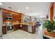 Spacious kitchen with stainless steel appliances, wood cabinets, and plenty of counter space at 4553 W Kirkland Ave, San Tan Valley, AZ 85144