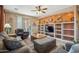 Comfortable living room with a built-in entertainment center, recessed lights, ceiling fan, and access to the outdoor living space at 4553 W Kirkland Ave, San Tan Valley, AZ 85144