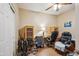 Functional office space with room for multiple workstations, and ample space for storage, with a ceiling fan at 4553 W Kirkland Ave, San Tan Valley, AZ 85144