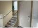 Entryway featuring a staircase, a modern railing, and natural light at 6605 N 93Rd Ave # 1071, Glendale, AZ 85305