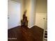 Hallway featuring wood floors, a side table, and neutral walls at 6605 N 93Rd Ave # 1071, Glendale, AZ 85305