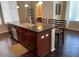 Kitchen with a large island, dark wood cabinets, granite countertops, and stainless steel appliances at 6605 N 93Rd Ave # 1071, Glendale, AZ 85305
