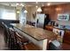 Open kitchen featuring stainless steel appliances, a center island with seating, and plenty of counter space at 6605 N 93Rd Ave # 1071, Glendale, AZ 85305