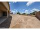Large backyard area offering plenty of space for outdoor activities or customization at 6713 S 76Th Dr, Laveen, AZ 85339