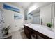 Bright bathroom with neutral color scheme and decorations, featuring double sink vanity at 6713 S 76Th Dr, Laveen, AZ 85339