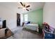 Inviting bedroom with carpeted floors and a walk-in closet for ample storage at 6713 S 76Th Dr, Laveen, AZ 85339