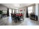 Dining room featuring a large table, seating for eight, tile floors, and natural lighting at 6713 S 76Th Dr, Laveen, AZ 85339