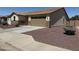 Well maintained single story home featuring desert landscaping, two car garage, and private entryway at 6713 S 76Th Dr, Laveen, AZ 85339