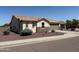 Attractive home featuring desert landscaping, a tile roof, and a two car garage at 6713 S 76Th Dr, Laveen, AZ 85339