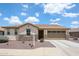 Charming single-story home with stone accents, desert landscaping, and a two-car garage at 6713 S 76Th Dr, Laveen, AZ 85339