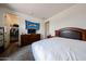 A cozy main bedroom with a large bed, dresser, and a closet at 6713 S 76Th Dr, Laveen, AZ 85339