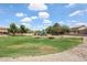 Lush green park with playground and walking paths, perfect for Gathering activities and enjoying the outdoors at 6713 S 76Th Dr, Laveen, AZ 85339