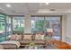 Cozy living room featuring comfortable seating and large windows overlooking a lush, green exterior at 7157 E Rancho Vista Dr # 2012, Scottsdale, AZ 85251