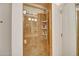 Luxurious walk-in shower with glass door, travertine tile, and built-in shelving for a spa-like experience at 7157 E Rancho Vista Dr # 2012, Scottsdale, AZ 85251