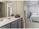 Bathroom featuring a modern vanity, framed mirror, and neutral color scheme at 7180 W Tombstone Trl, Peoria, AZ 85383