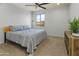 Bedroom featuring natural lighting, carpet flooring, and ceiling fan at 7180 W Tombstone Trl, Peoria, AZ 85383