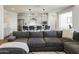 Living room features a cozy couch, light floors, recessed lights, and an open view to the kitchen at 7180 W Tombstone Trl, Peoria, AZ 85383