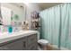 Stylish bathroom with modern vanity, neutral colors, and tiled floors for a spa-like retreat at 7317 S 37Th Gln, Phoenix, AZ 85041