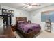Cozy bedroom with natural light, ceiling fan, and a relaxing ambiance for restful nights at 7317 S 37Th Gln, Phoenix, AZ 85041