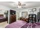 Functional bedroom with dresser, TV and mirror; perfect for organization and relaxation at 7317 S 37Th Gln, Phoenix, AZ 85041
