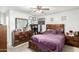 Well-appointed bedroom with a modern dresser, TV and ceiling fan for added comfort at 7317 S 37Th Gln, Phoenix, AZ 85041