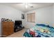 Inviting bedroom with ceiling fan and ample natural light creating a serene atmosphere at 7317 S 37Th Gln, Phoenix, AZ 85041