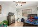 Bright bedroom, featuring tile floors and ample space, perfect for personalization and relaxation at 7317 S 37Th Gln, Phoenix, AZ 85041