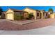 Single-story home with a two car garage, desert landscaping, and a tile roof at 7317 S 37Th Gln, Phoenix, AZ 85041