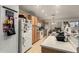 Bright kitchen with wood cabinets, modern appliances, and a tile floor at 7317 S 37Th Gln, Phoenix, AZ 85041