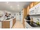 Bright kitchen featuring tile floors, modern appliances, and ample counter space for culinary creations at 7317 S 37Th Gln, Phoenix, AZ 85041