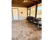 Relaxing sunroom with screened windows and comfortable seating, perfect for enjoying the outdoors at 735 E Desert Ave, Apache Junction, AZ 85119