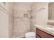Updated bathroom featuring tile shower, niche, and stone vanity at 7359 N 39Th Ave, Phoenix, AZ 85051