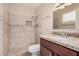 Updated bathroom with tile shower and stone vanity at 7359 N 39Th Ave, Phoenix, AZ 85051
