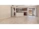Well-lit kitchen featuring modern appliances, granite countertops, and dark wood cabinets at 7359 N 39Th Ave, Phoenix, AZ 85051
