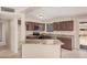 Functional kitchen featuring granite countertops, stainless steel appliances, and dark wood cabinetry at 7359 N 39Th Ave, Phoenix, AZ 85051