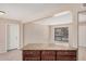 Kitchen island features stone countertops and wooden cabinetry at 7359 N 39Th Ave, Phoenix, AZ 85051