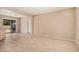 Bright living room with neutral walls, tile flooring, and a sliding glass door leading to the outdoors at 7359 N 39Th Ave, Phoenix, AZ 85051