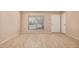 Spacious living room with neutral paint and tile flooring, illuminated by a bright, large window at 7359 N 39Th Ave, Phoenix, AZ 85051