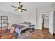 Comfortable bedroom with vaulted ceiling, ceiling fan, and wood floors, creating a relaxing atmosphere at 7405 W Elwood St, Phoenix, AZ 85043