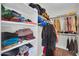 Walk-in closet with built-in shelves and hanging rods offering plenty of storage space at 7405 W Elwood St, Phoenix, AZ 85043