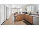Bright kitchen with stainless steel appliances, oak cabinets, and an eat-in dining area at 7405 W Elwood St, Phoenix, AZ 85043