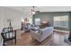 Bright and airy living room with wood floors, vaulted ceilings, and modern furniture at 7405 W Elwood St, Phoenix, AZ 85043