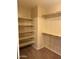 Bedroom closet featuring shelves and dual closet rods for ample storage at 7422 W Superior Ave, Phoenix, AZ 85043