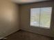 Neutral bedroom with window with blinds for natural light at 7422 W Superior Ave, Phoenix, AZ 85043