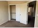 Bedroom features standard closet with sliding doors and neutral color walls at 7422 W Superior Ave, Phoenix, AZ 85043