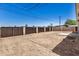 Spacious backyard featuring block fencing and dirt landscaping ready for customization and outdoor enjoyment at 802 W Buist Ave, Phoenix, AZ 85041