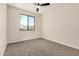 Bedroom with carpet, ceiling fan, and a window with a view at 802 W Buist Ave, Phoenix, AZ 85041